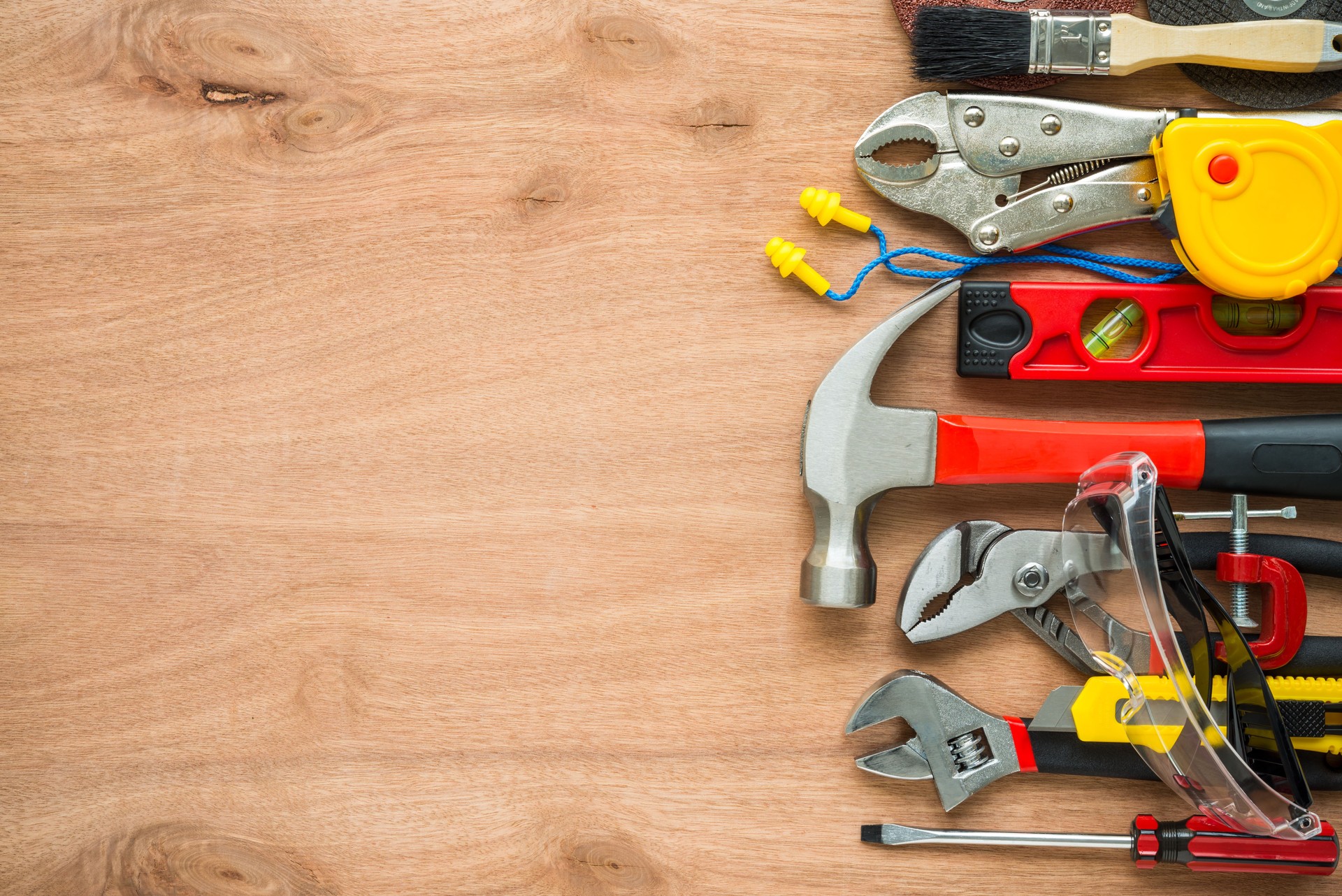 Flat lay, set of construction hardware tools building, repair, painting accessories on wooden background.